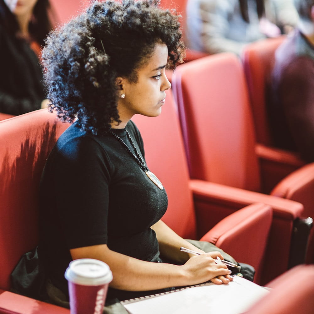 Female student looking very serious in a lecture