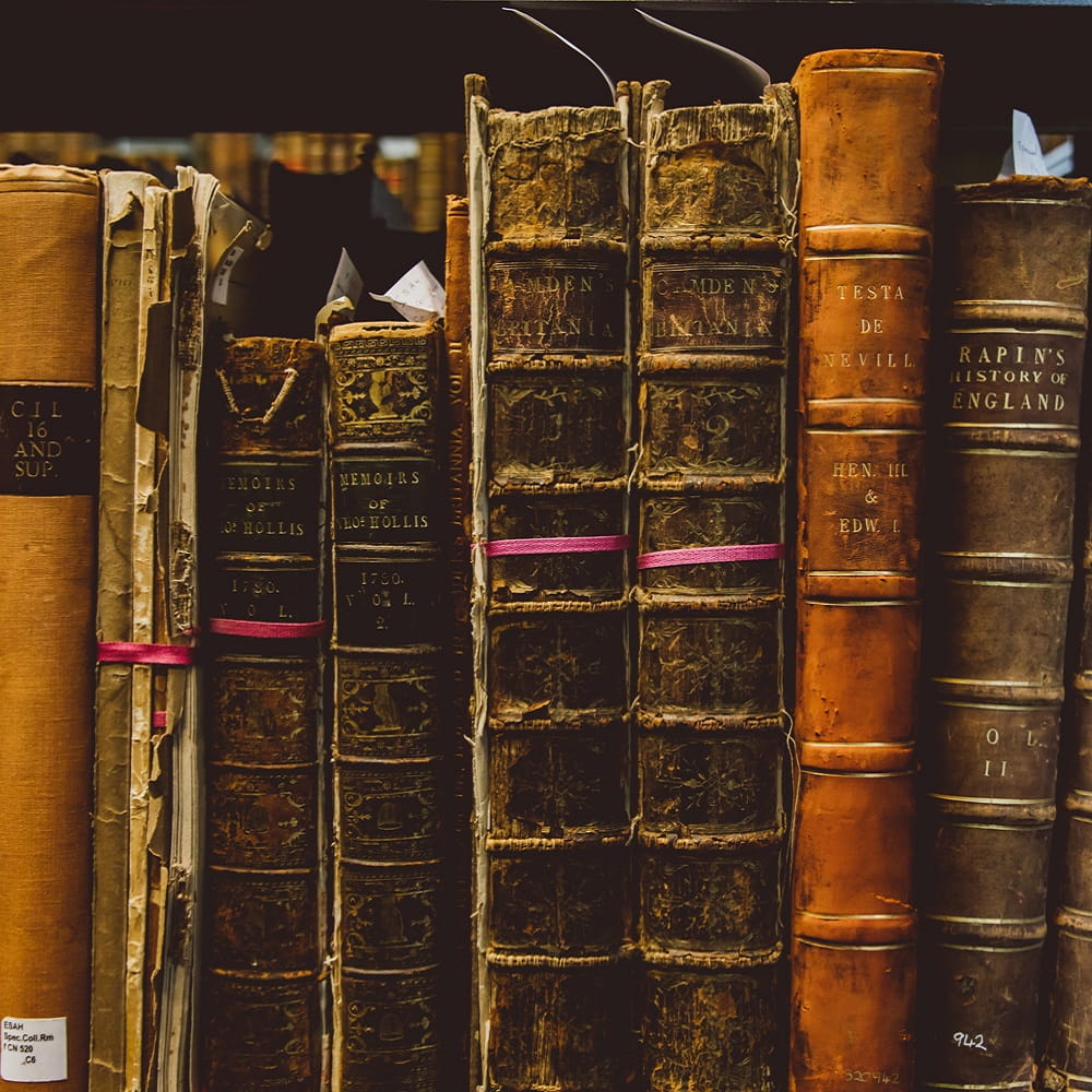 A row of old looking library books
