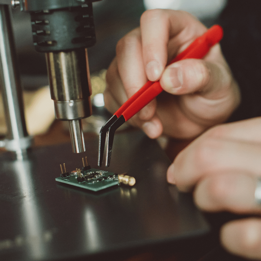 A student studying a PCB