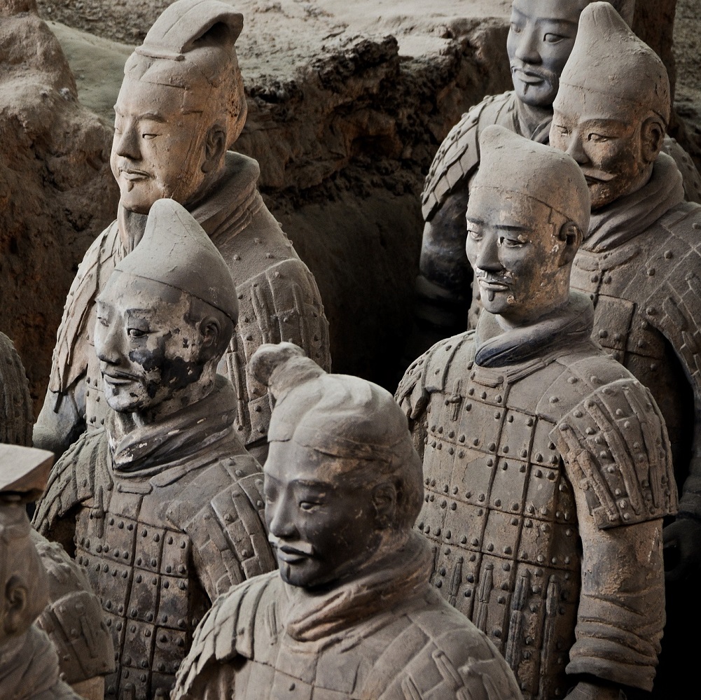 6 terracotta warriors of Xi'an, with various types of headwear and some light damage to some of the faces.