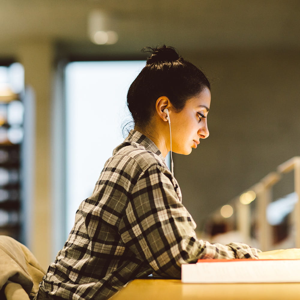 student working in library