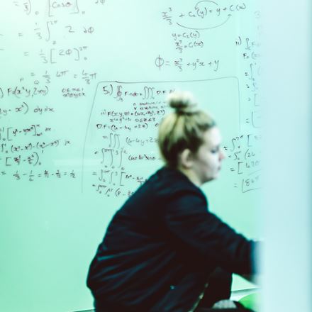 Female student with maths equations
