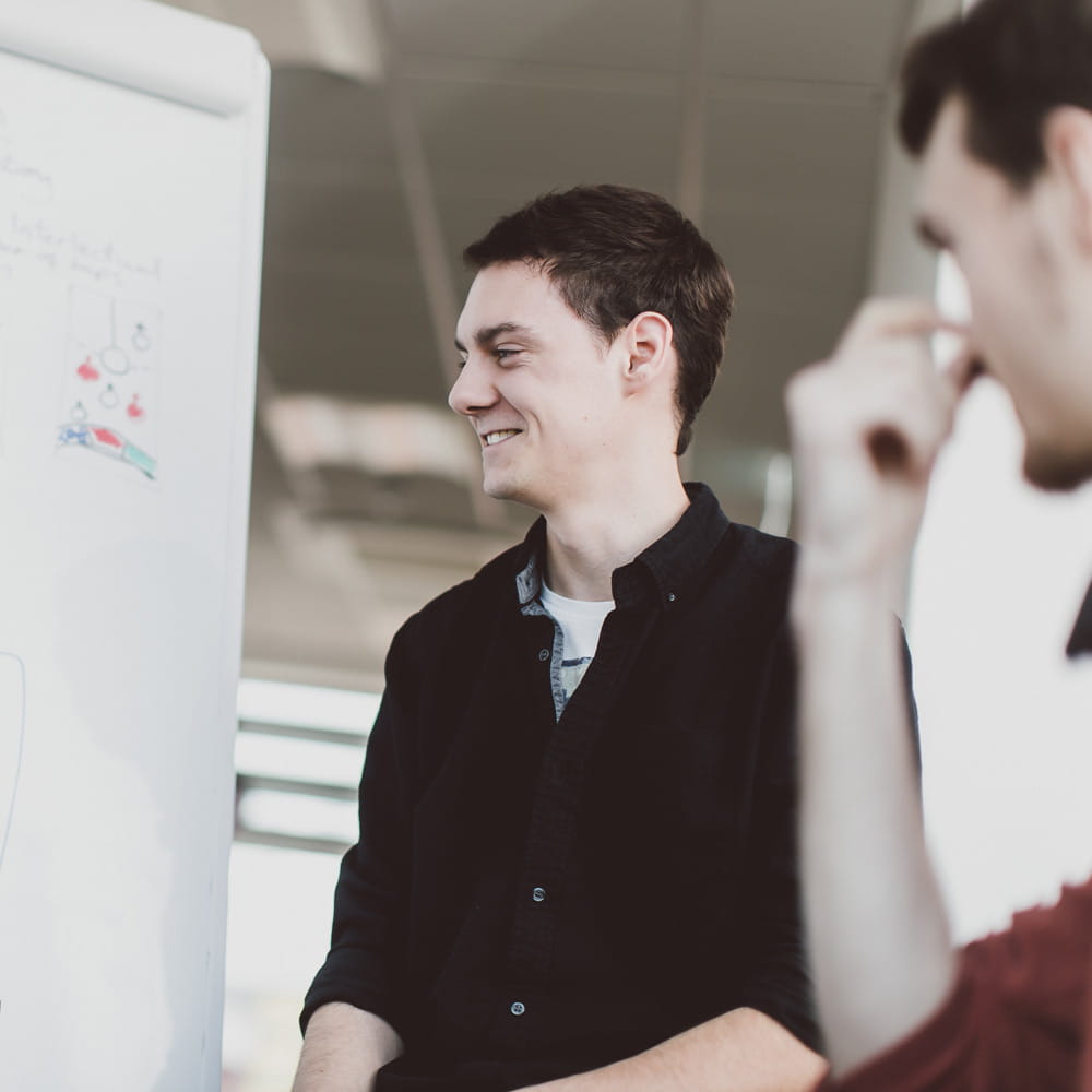 Man presenting information on a flipchart