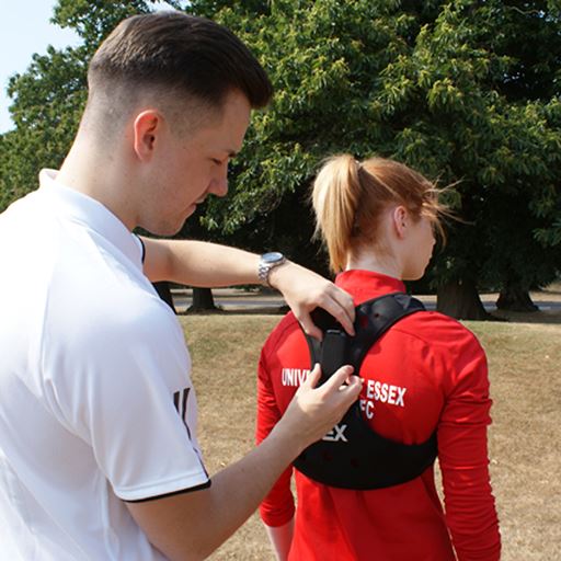 Athlete being fitted with GPS tracker