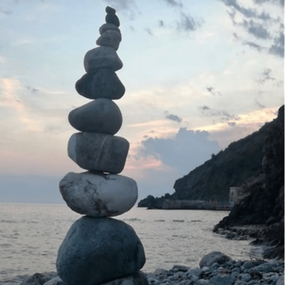 Pebbles stacked on top of each other on the beach