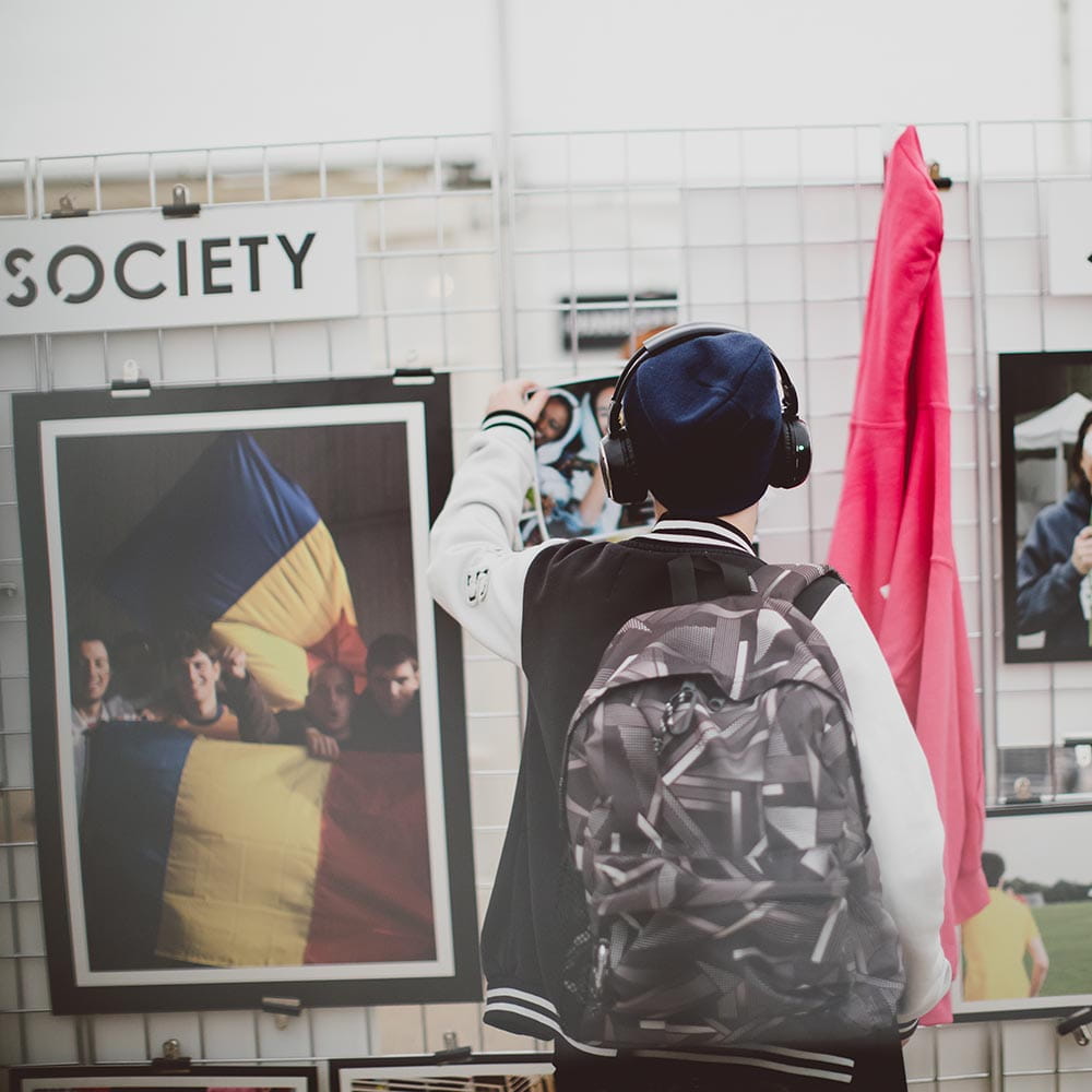 student looking at different societies on campus