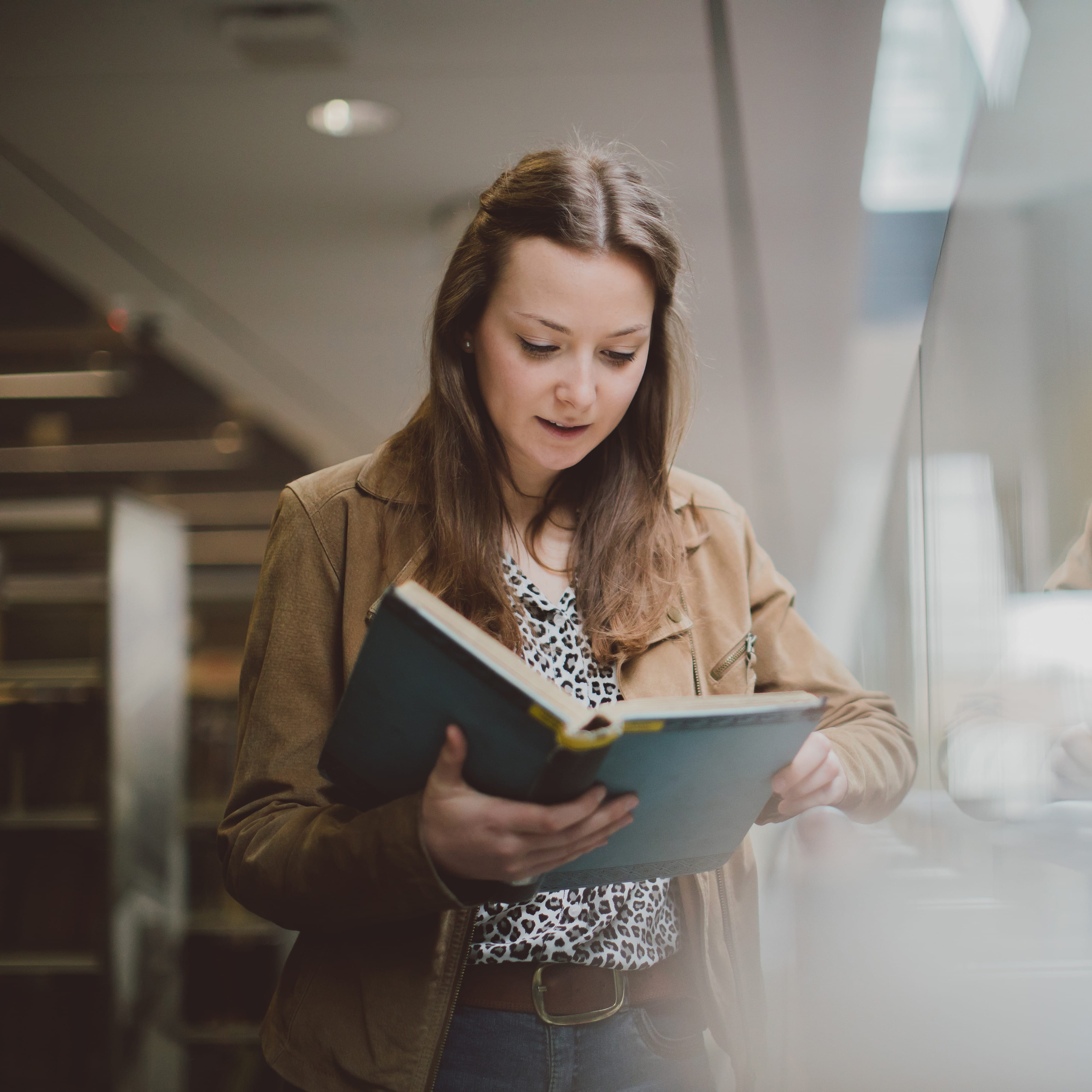 Student reading in the library