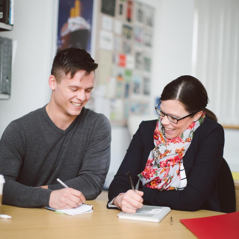 Student being supported by member of staff