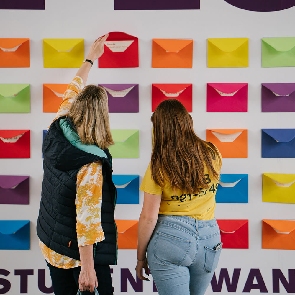 Students opening envelopes at June Open Day 2019