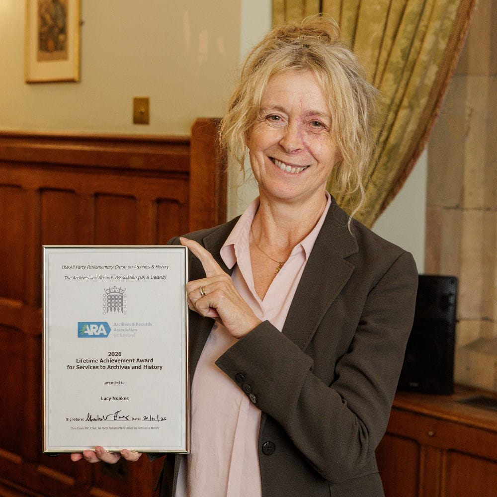 Professor Lucy Noakes holding her award
