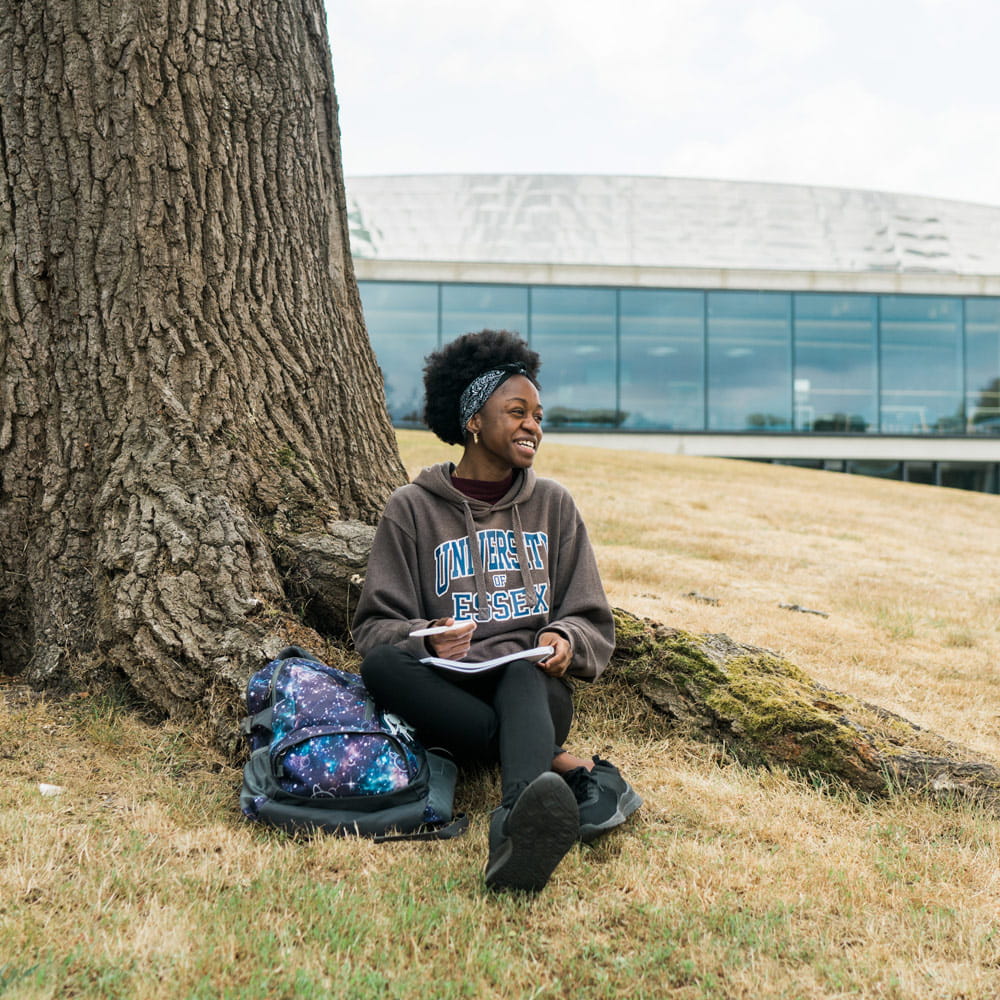Student enjoying Wivenhoe Park