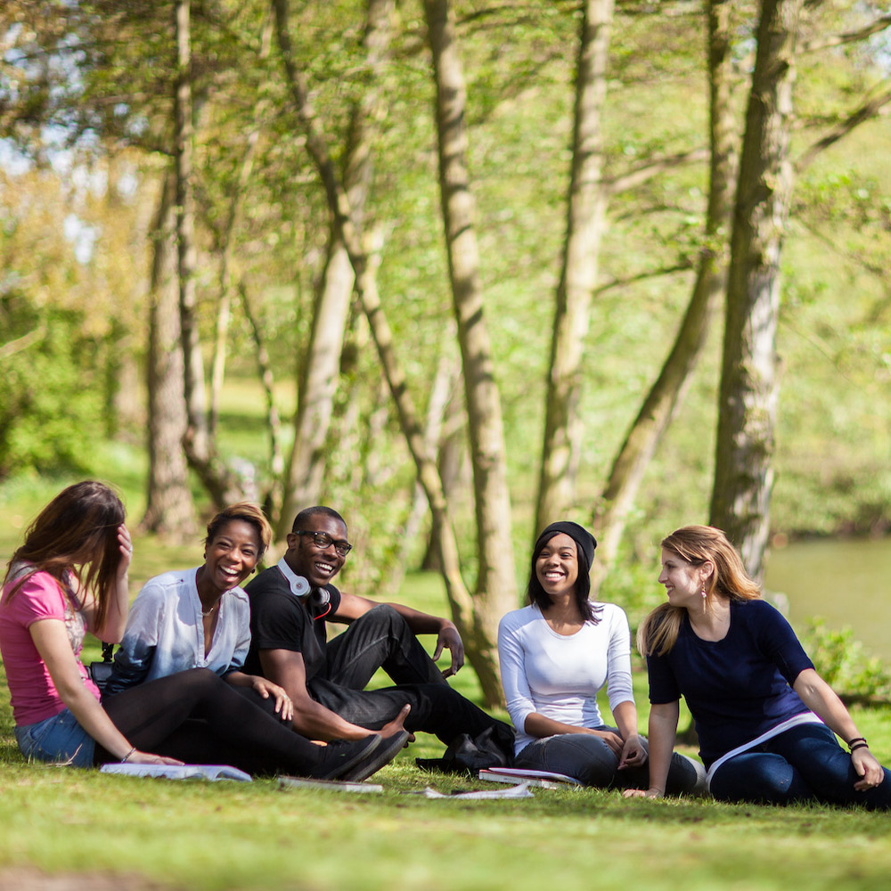 Students beside the lake at our Colchester Campus