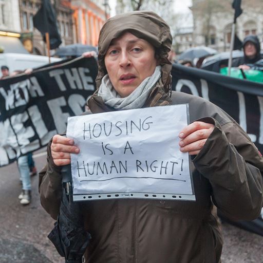 Picture of woman holding a poster about human rights