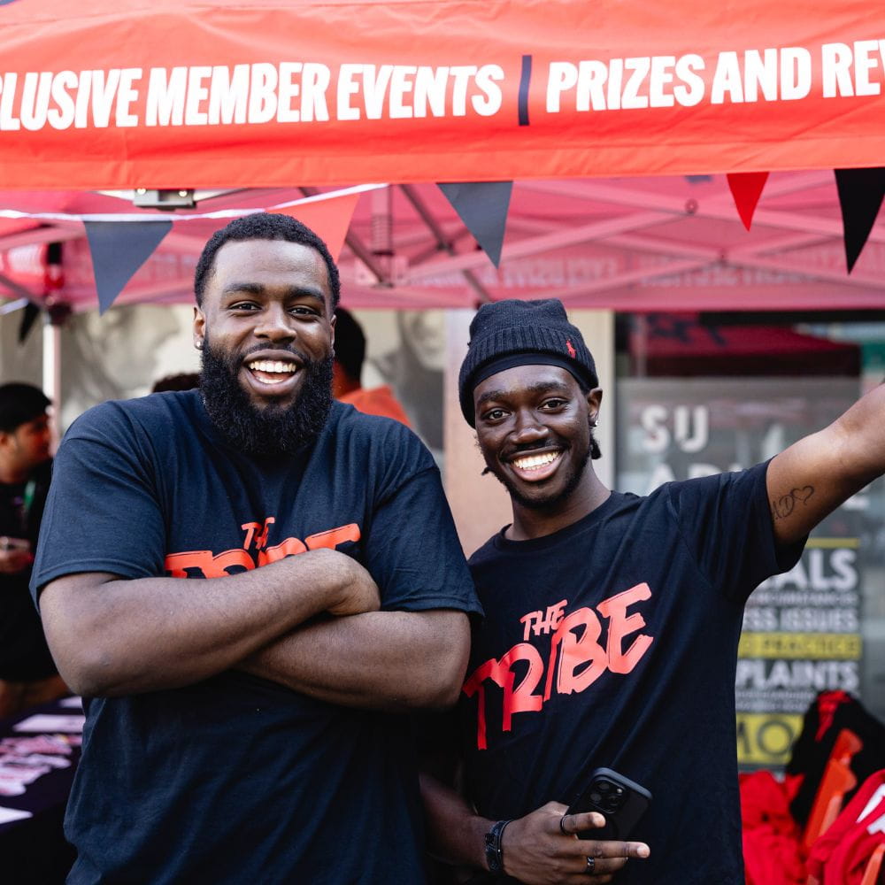 two men smiling at the camera