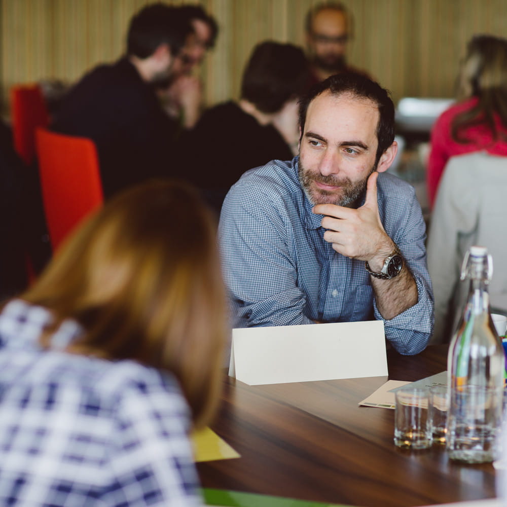 Groups having discussions at tables