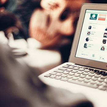 Photo of Apple laptop with screens open