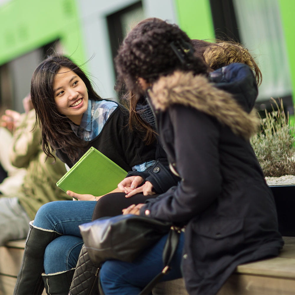 Two female students talking 