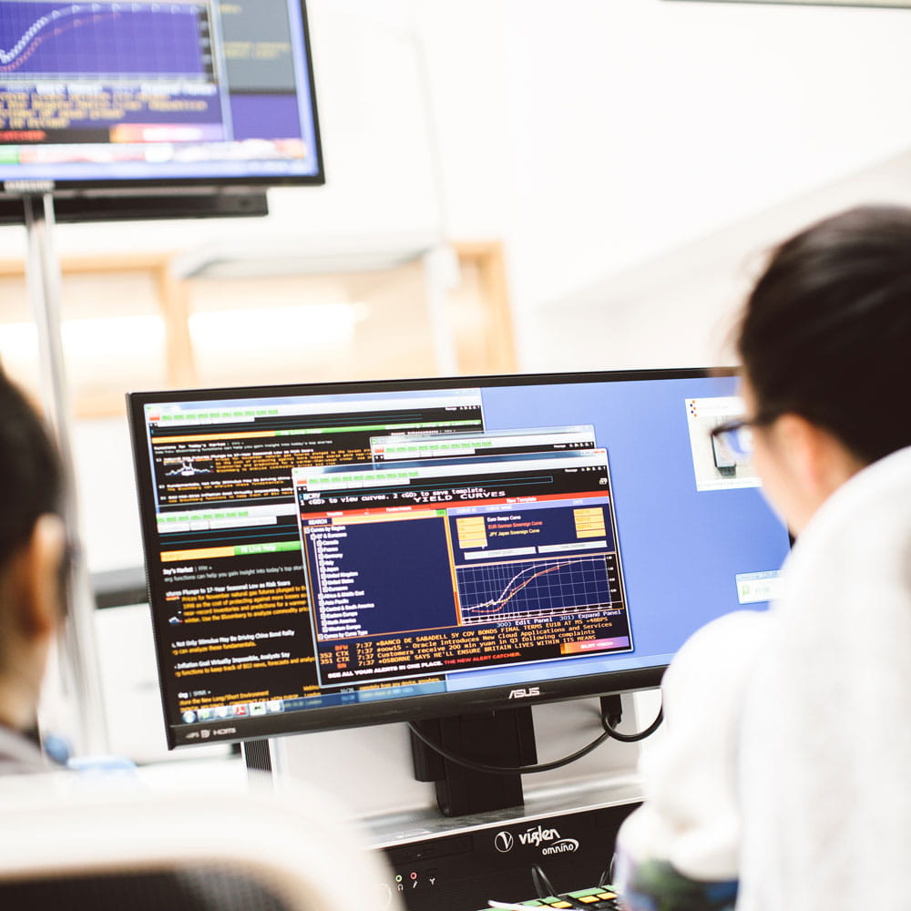 Students working in the trading room