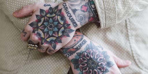 Tattoos on Matt Lodder's hands