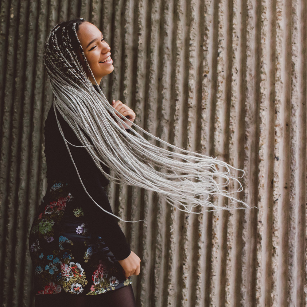 Shannice swishing her silver braids around.