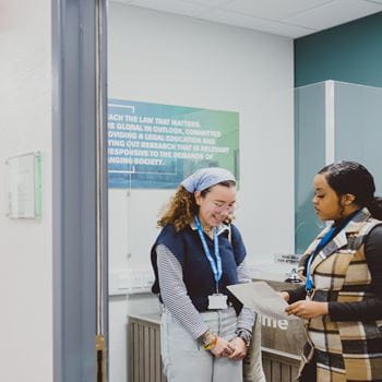 Student asking for help at Law reception