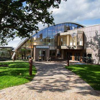 An outside shot of the Essex Business School building with a path leading to the door.