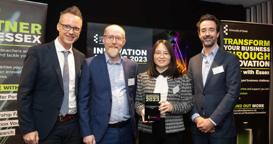 The Preqin team collecting their award from Pro-Vice-Chancellor, Research, Professor Chris Greer