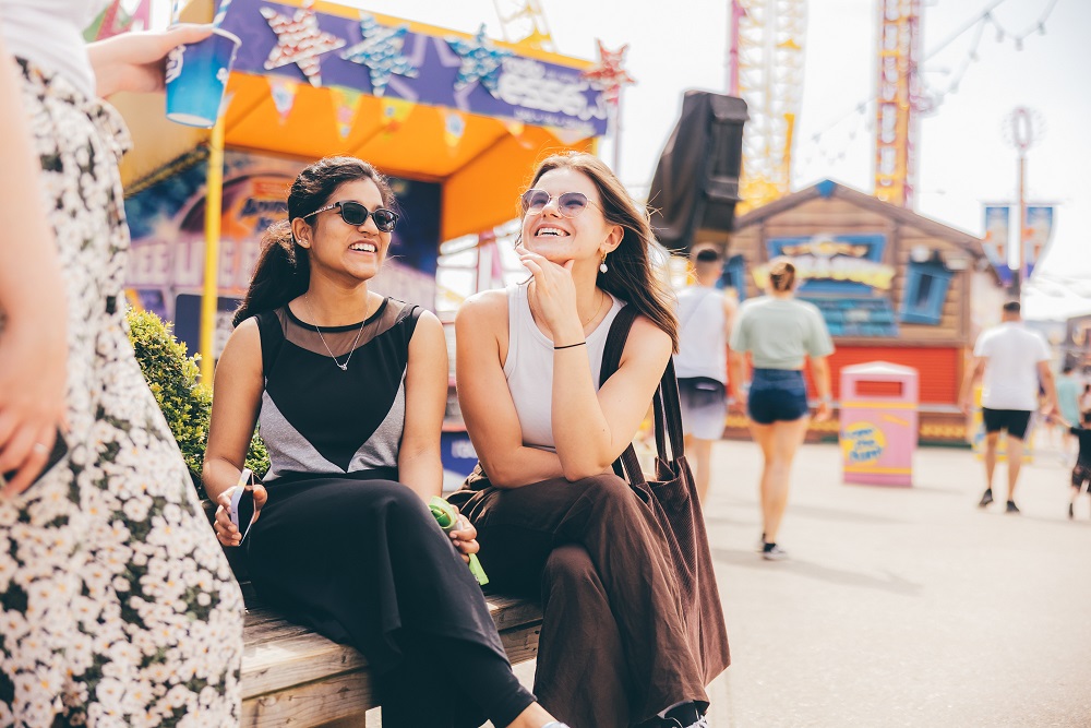 Two students laughing on Southend seafront
