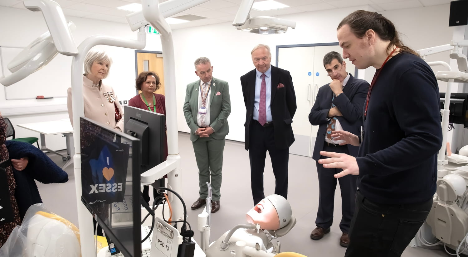 The Lord-Lieutenant watches a demonstration taking place inside a dental lab