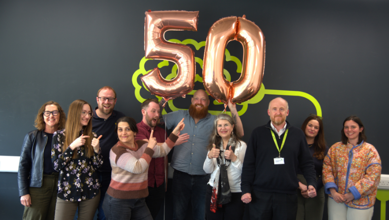 The KTP team celebrating the achievement with a 50th balloon