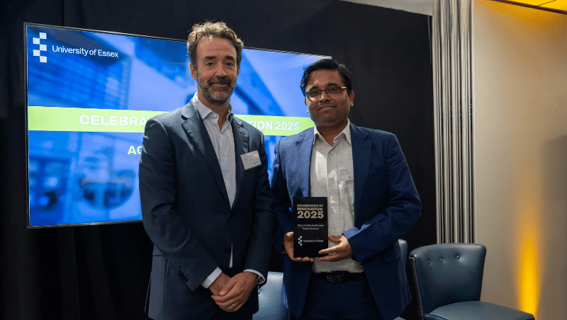 Pro Vice-Chancellor for Research Professor Chris Greer with Academic of the Year winner Professor Niraj Kumar