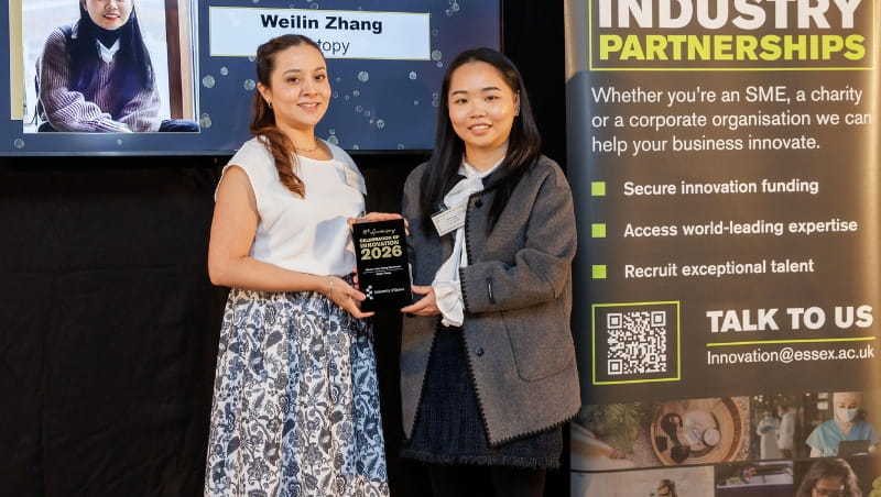 Weilin Zhang being presented their award