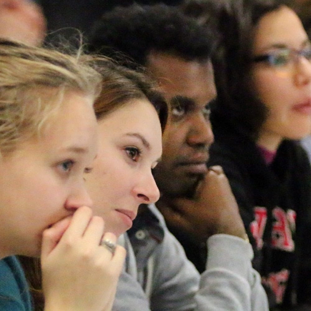 Four students faces during lecture