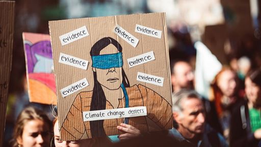 Climate change deniers sign in environmental march