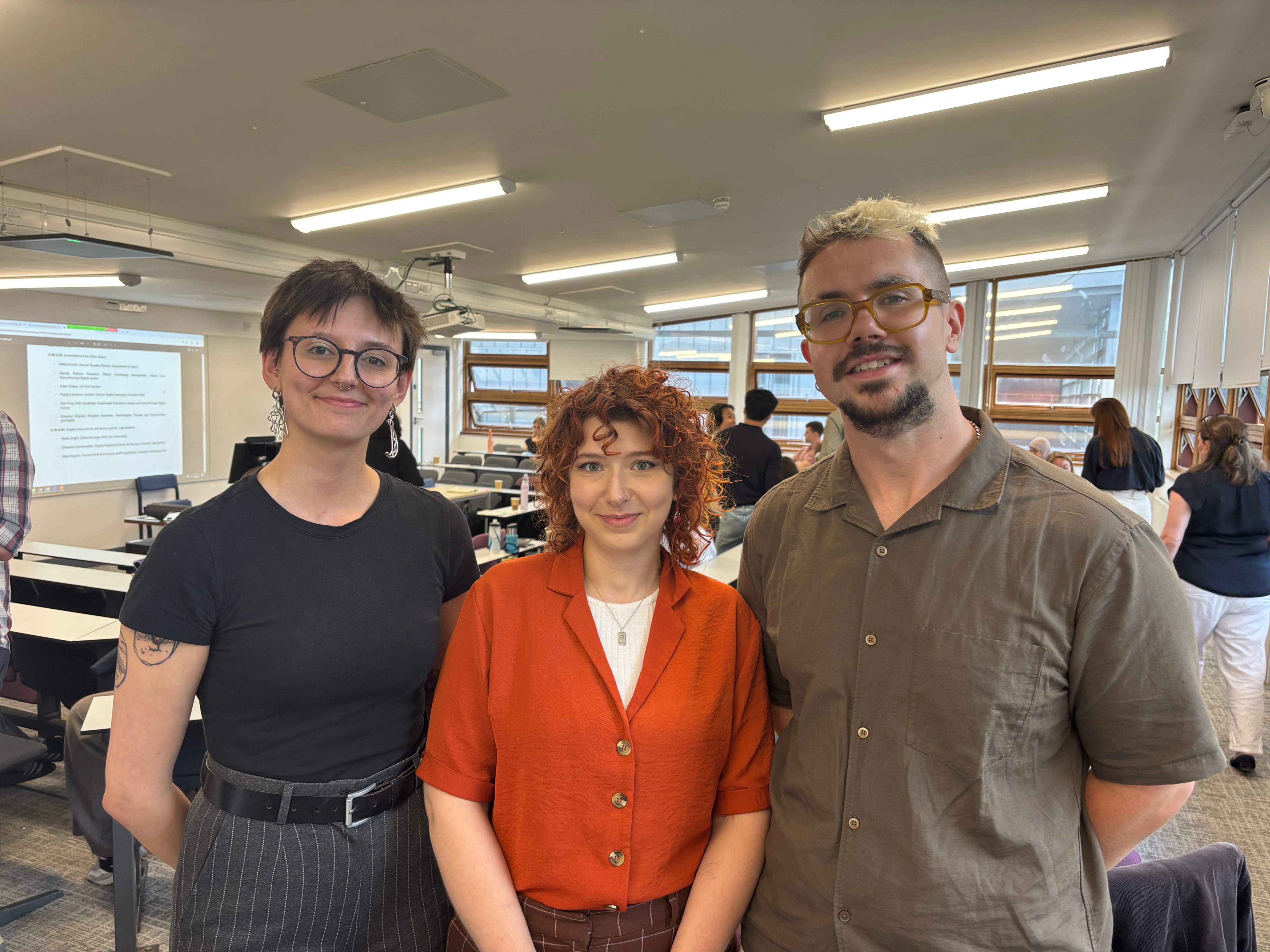Zuzanna, Sian and Paddy stood together in the conference seminar room.