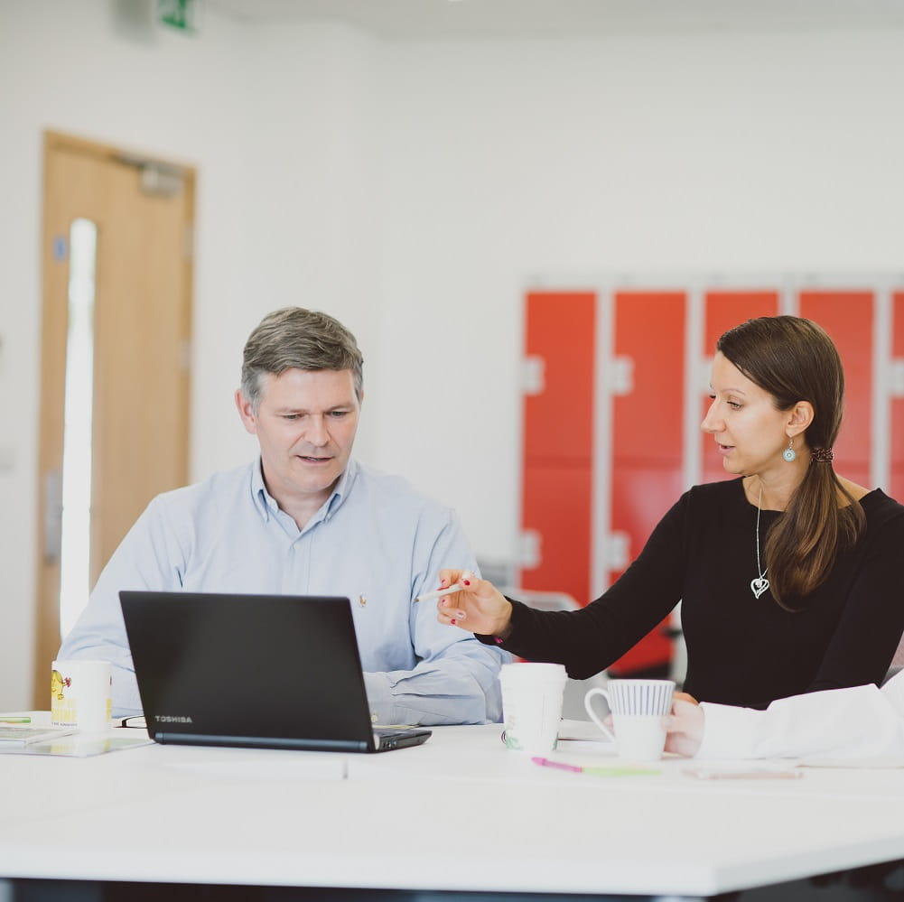 two people meeting with laptop