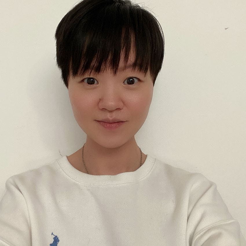 Headshot of student, Hannah, against a white wall