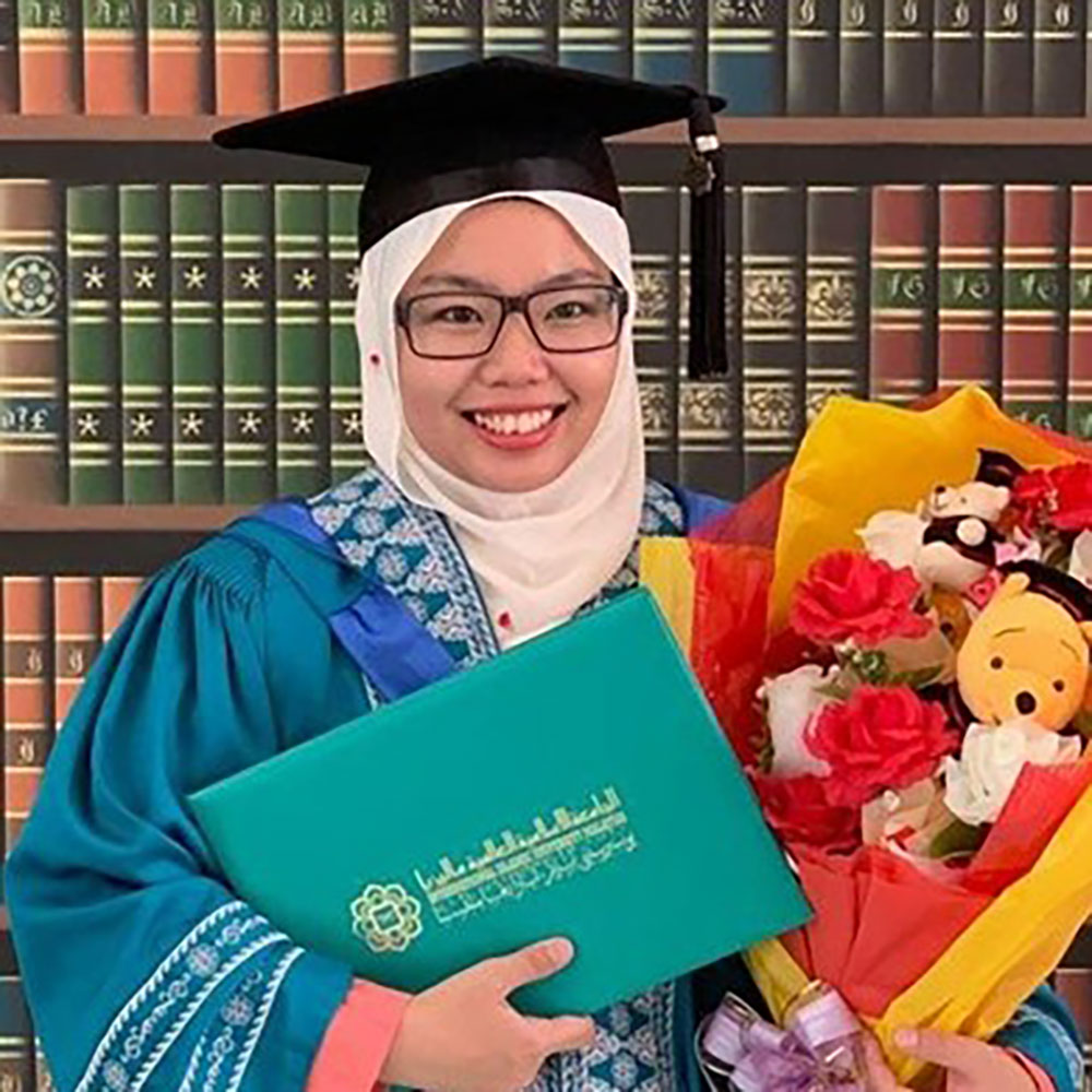 Headshot of Aisyah Shamshun. Aisyah is wearing a graduation cap and gown. 