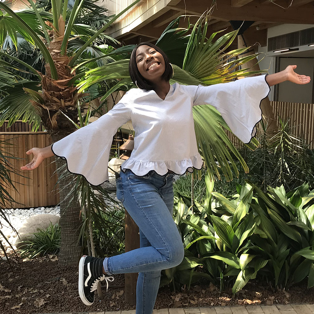 BSc Accounting and Management student Debbie Yeboa strikes a pose in the Essex Business School winter garden