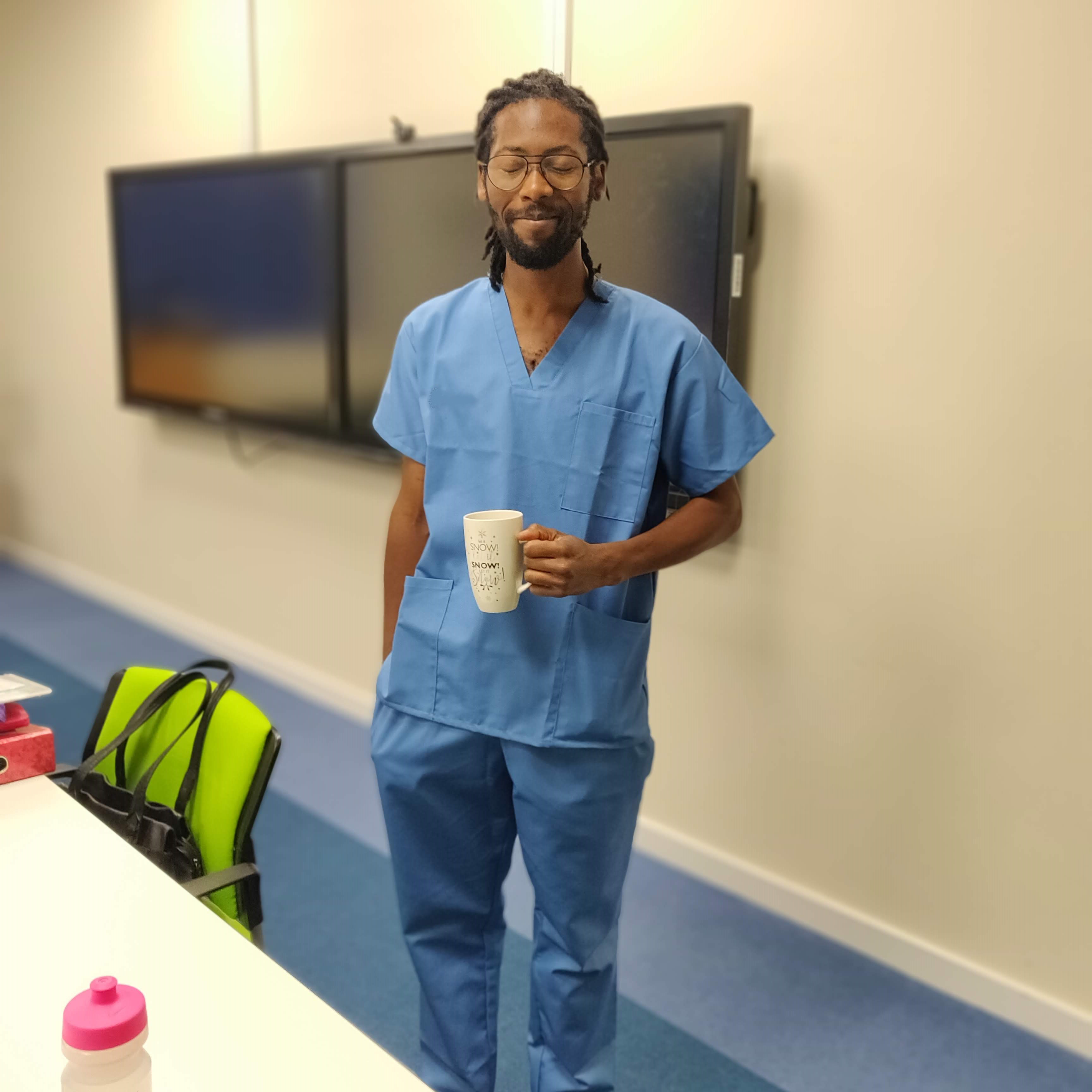 Student Franklin in blue medical scrubs