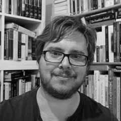 Dr Matthew Bowman, Lecturer in Arts, University of Suffolk, a black and white headshot