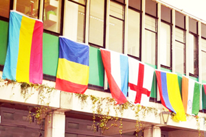 Country flags hanging from the windows in Square 3, including the Romanian flag
