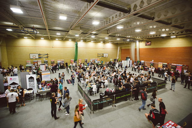 Sports Hall filled with stands and people for the Open Day