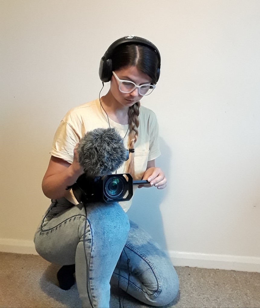 Picture of Elena, filming using a video camera