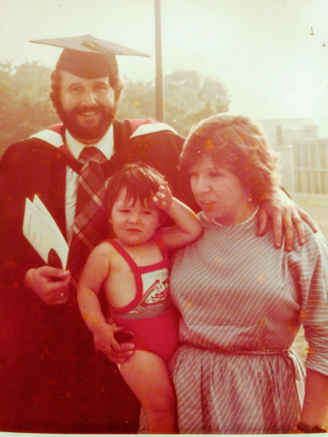 Mike Rose with his wife and son on his graduation day in 1982