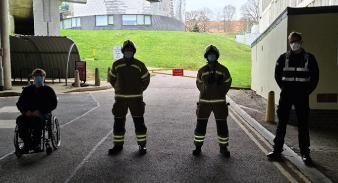 Fire fighters standing under the Essex podia