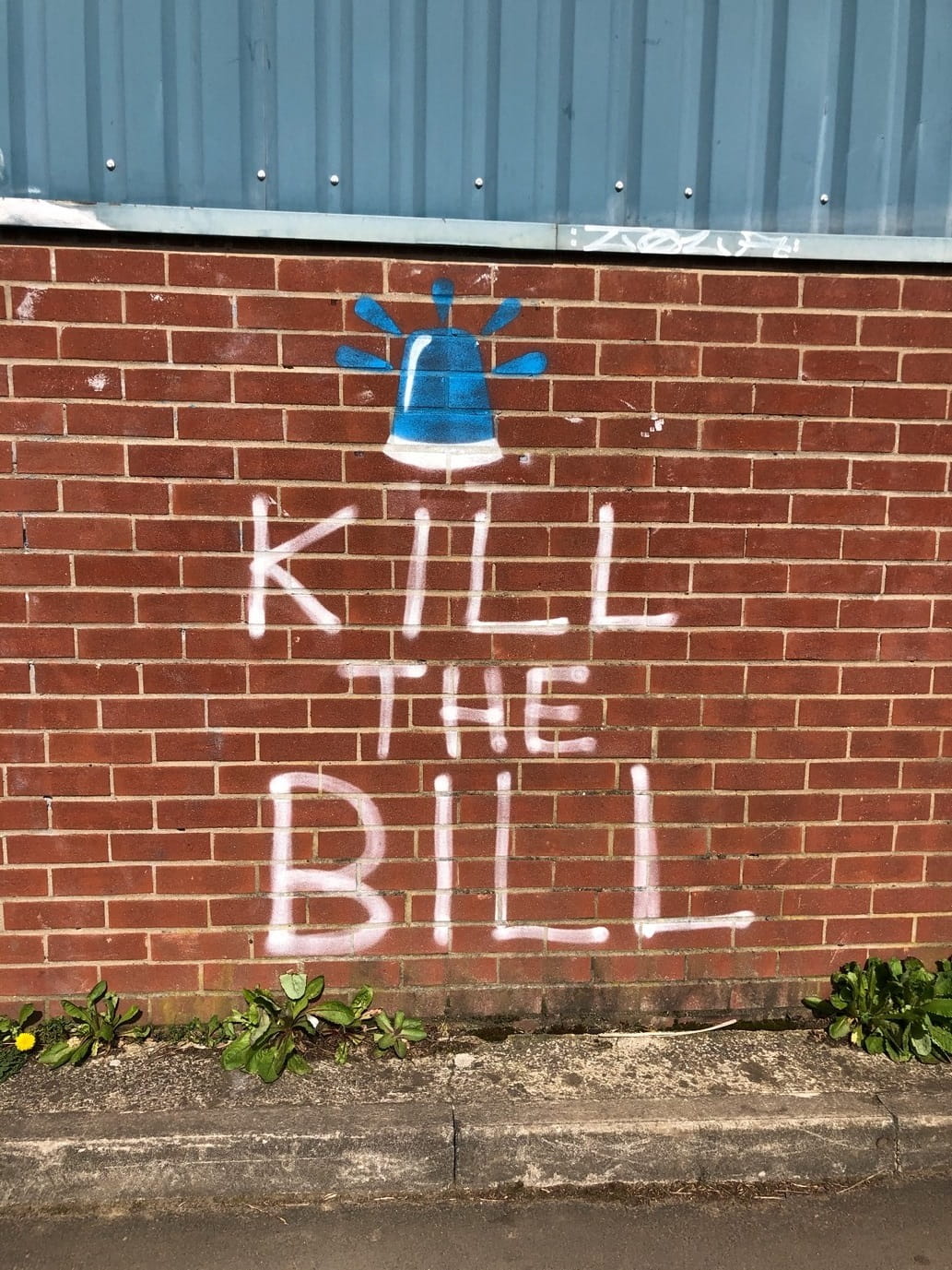 Graffiti on wall saying Kill The Bill
