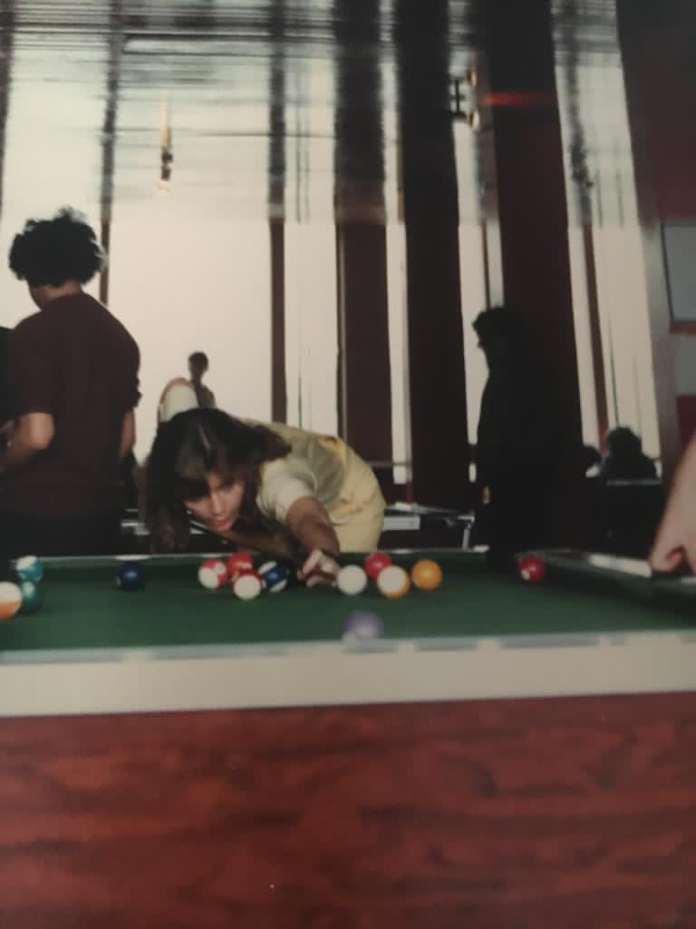 Archive photo of Jayne playing pool on campus