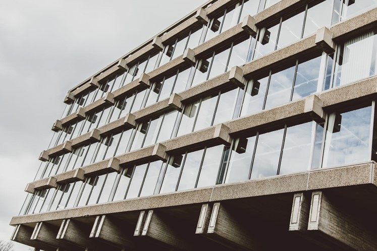 Photo of one side of the Albert Sloman Library, highlighting the concrete and glass architecture of the building.