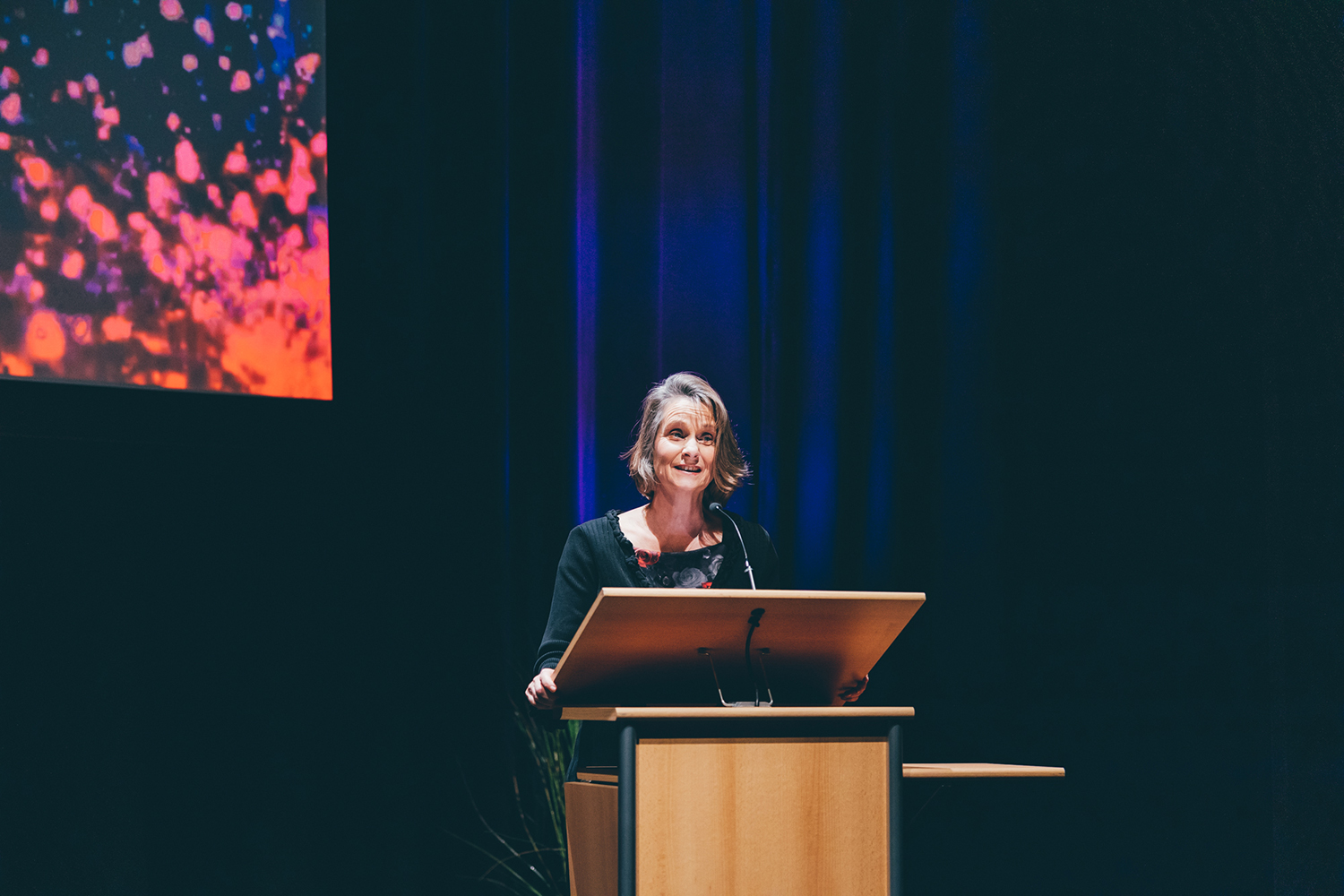 Madeline Eacott at a lectern at the Excellence in Education Awards 2022.